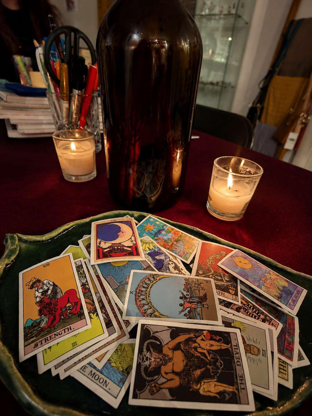 Tarot cards and candles arranged for a reading